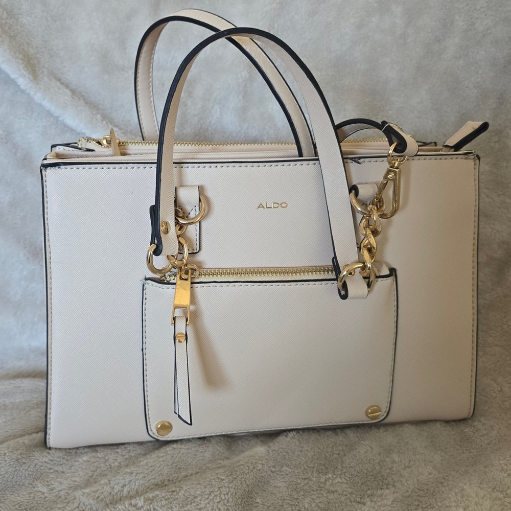 ALDO large light pink/cream colored bag with crossbody strap.